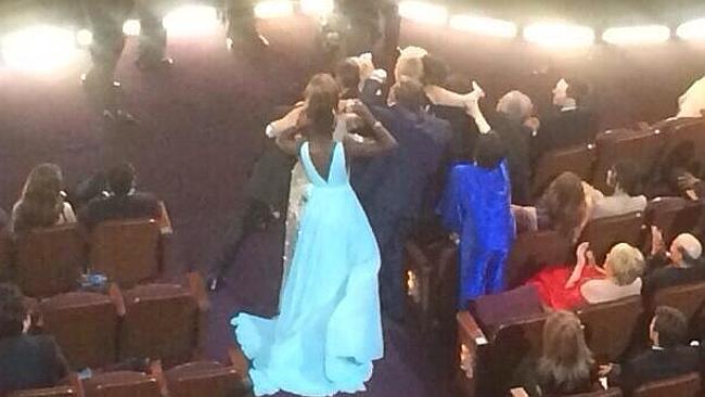 Liza Minnelli (in blue) missing out on Ellen's selfie picture at the Oscars