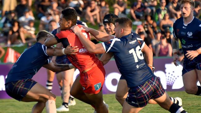 Hingano is hauled back from the try line by the Scotland defense during the weekend’s clash.