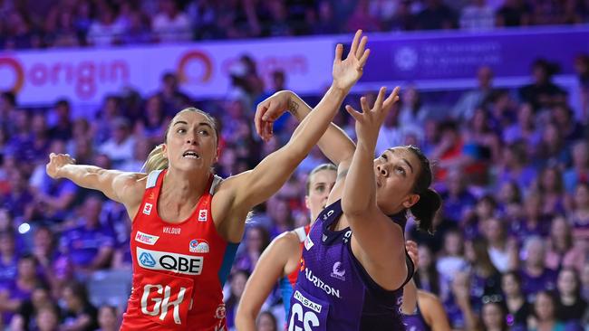 BRISBANE, AUSTRALIA - APRIL 28: Sarah Klau of the Swifts and Donnell Wallam of the Firebirds compete for the ball during the round three Super Netball match between Queensland Firebirds and NSW Swifts at Nissan Arena, on April 28, 2024, in Brisbane, Australia. (Photo by Albert Perez/Getty Images)