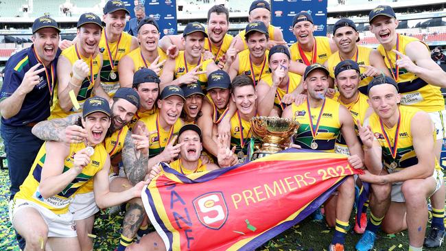 Eagles coach Jade Sheedy (left) celebrates the club’s 2021 grand final win against Glenelg with his players. Picture: Sarah Reed.