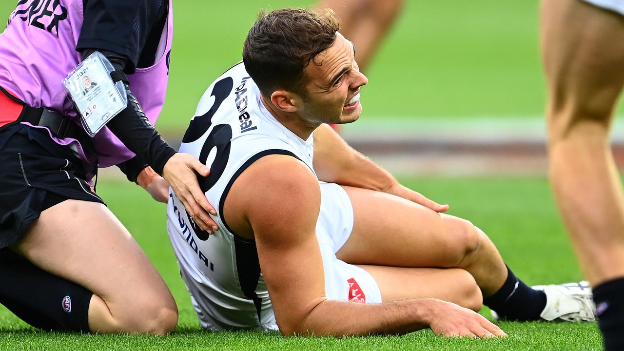 David Cuningham is attended to by trainers after rupturing his left ACL. Picture: Getty Images