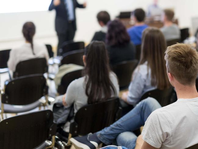 ONE TIME WEB USE FOR NEWS.COM.AU ONLY - FEES APPLY -  PX1FGR Professor lecturing in lecture hall at university.  Picture: Alamy