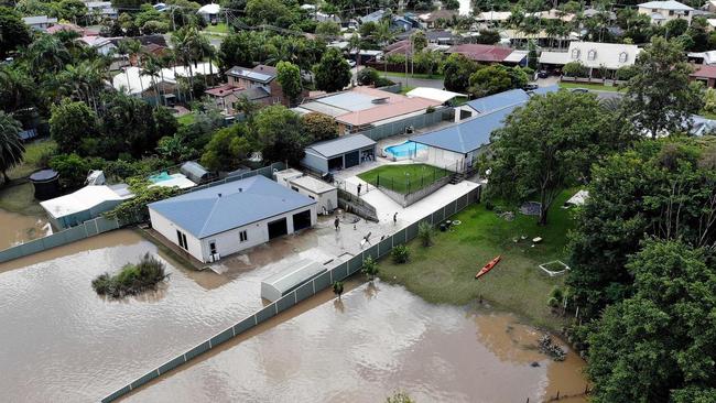 Water lapping at the doorsteps of houses in Logan’s Bethania in 2022. PHOTO: Adam Head