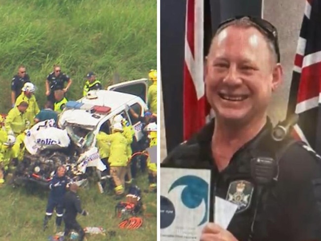 A police officer has been flown to hospital with life threatening injuries after a crash involving a police vehicle and a truck on a major Queensland highway. 