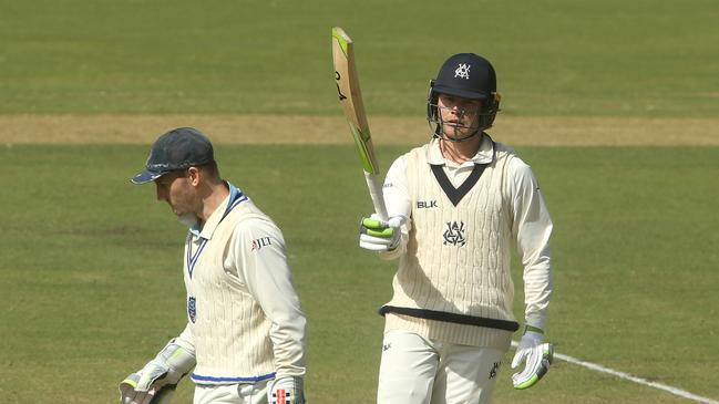 Will Pucovski of Victoria (right) reaches 50 with Peter Nevill of New South Wales looking on during day 3 of the JLT Sheffield Shield Final between Victoria and New South Wales at Junction Oval in Melbourne, Saturday, March 30, 2019. (AAP Image/Hamish Blair) NO ARCHIVING, EDITORIAL USE ONLY, IMAGES TO BE USED FOR NEWS REPORTING PURPOSES ONLY, NO COMMERCIAL USE WHATSOEVER, NO USE IN BOOKS WITHOUT PRIOR WRITTEN CONSENT FROM AAP