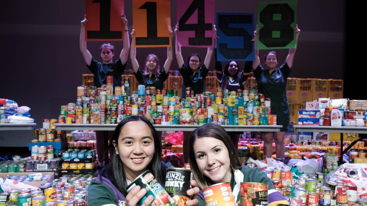 Centenary Heights State High School student council president Ria Biscocho and vice president Lily Pederick. Food donation to Lifeline Darling Downs.