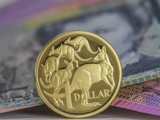 Australian $1 coin and notes close-up, investing, generic