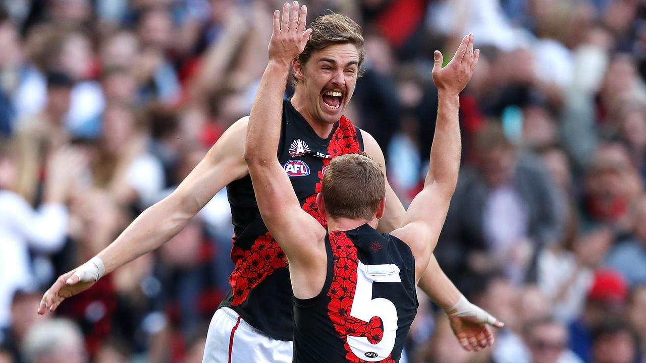 Joe Daniher celebrates a goal with Devon Smith last 