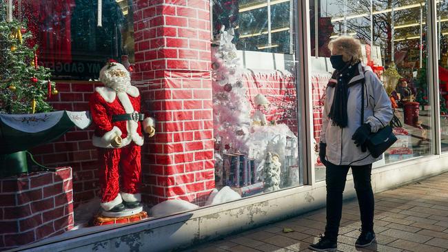 A woman walks a Christmas display in Hull town in England on Friday. Picture: Getty Images