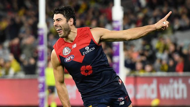 MELBOURNE, AUSTRALIA – APRIL 24: Christian Petracca of the Demons celebrates kicking a goal during the round six AFL match between the Melbourne Demons and the Richmond Tigers at Melbourne Cricket Ground on April 24, 2021 in Melbourne, Australia. (Photo by Quinn Rooney/Getty Images)