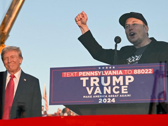 Tesla CEO Elon Musk (right) speaks on stage as he joins Donald Trump during a campaign rally. Mark Zuckerberg will have Meta copy X’s ‘Community Notes’ feature rather than use fact checkers. Picture: AFP