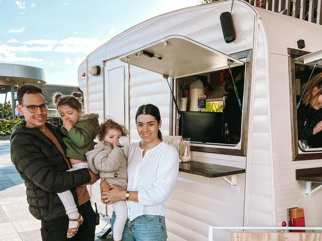 SOCIAL MEDIA IMAGE DISCUSS USE WITH YOUR EDITOR - Oikos owners Brett and Christie Briggs with their children Frankie and Feli outside their new coffee caravan at Tulmur Place.