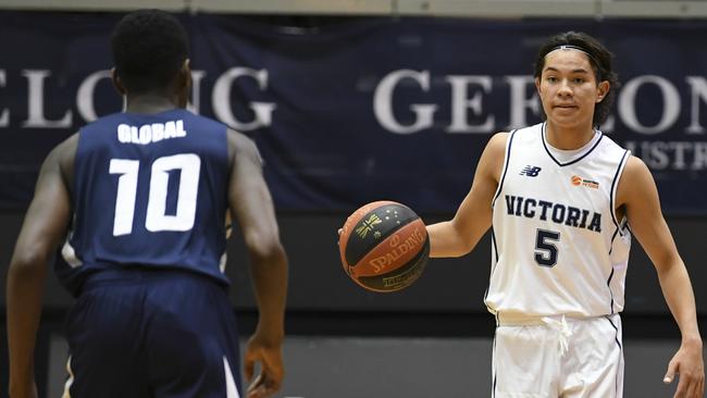 Joel Foxwell brings the ball down the court for Victoria during their win over the NBA Global Academy to open the Under-20 National Championships. Picture: Sports in Focus