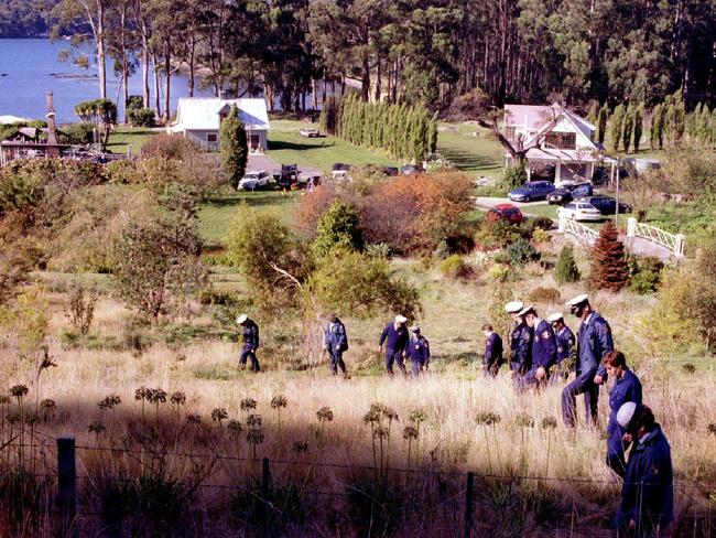 Police searching the grounds of Seascape guesthouse where Martin Bryant was arrested in 1996 following an all-night siege.