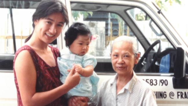 Penny Wong in 1988, holding her step-sister Jessica, alongside her grandmother Madam Lai Fung Shim, whom she called Poh Poh