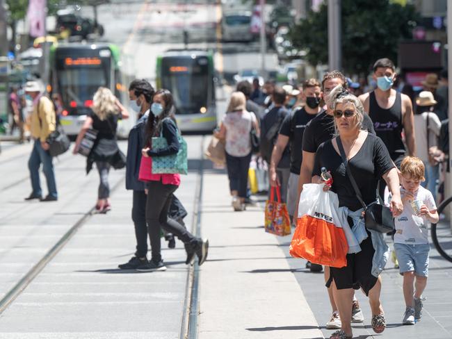 Melbourne City shoppers in the city. Crowds of shoppers with and without masks on Bourke St. Picture: Tony Gough