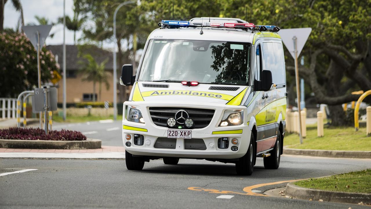 Paramedics tgreat a woman for minor injuries. 