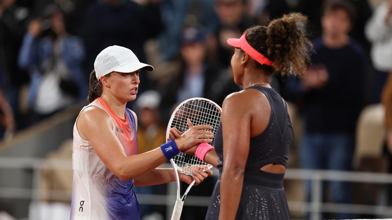 PARIS, FRANCE - MAY 29: Iga Swiatek of Poland (L) shakes hands with Naomi Osaka of Japan after her victory in the Women's Singles second round match during Day Four of the 2024 French Open at Roland Garros on May 29, 2024 in Paris, France. (Photo by Clive Brunskill/Getty Images)