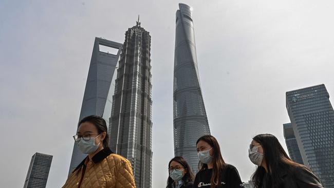 Chinese policymakers became alarmed at the end of last year by how sharply growth had slowed after Mr Xi tightened controls on private businesses, from tech giants to property developers. Above, the financial district of Shanghai. Picture: AFP