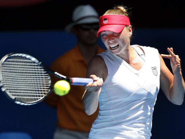 Vera Zvonareva returns to Bartoli during their quarter-final match of Australian Open Championships at Rod Laver Arena, Melbourne Park in Melbourne.