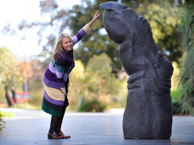 Sculptor Lisa Roet with her Chimpanzee Finger sculpture at the Adelaide Zoo.