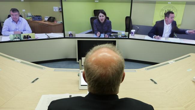 Prime Minister Scott Morrison speaks with (on screen) Jim McDowell, Chief Executive of the South Australia Department of Premier and Cabinet, Premier of NSW Gladys Berejiklian and Premier of Western Australia Mark McGowan during a National Cabinet meeting. Picture: Alex Ellinghausen