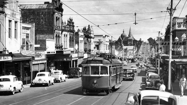 Burke Rd Camberwell shopping strip, looking south from the railway station, 1955.