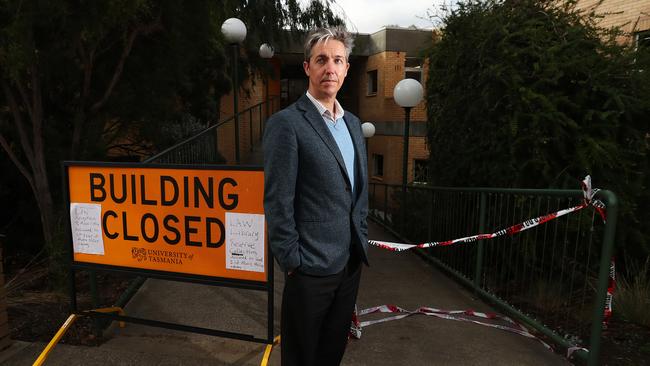 For Sun Tas. Professor Jason Byrne from the Geography and Spatial science department at UTAS in relation to the recent major flood event in Hobart. Picture in front of the flood damaged library. Picture: NIKKI DAVIS-JONES