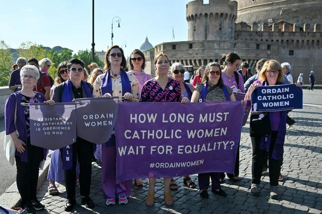 Supporters of Women's Ordination Conference (WOC) demonstrate near the Vatican