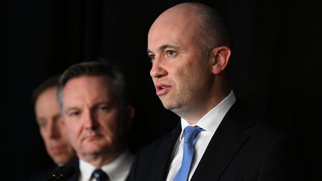 Federal Climate Change Minister Chris Bowen watches former NSW energy minster Matt Kean talking about Australia's transition to renewables. Picture: NCA NewsWire / Dan Peled