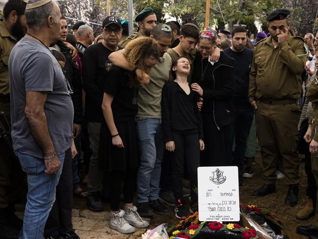 KFAR SABA, ISRAEL - DECEMBER 12:  Family members react during a funeral for  Maj. (res.) Eviatar Cohen on December 12, 2023 in Kfar Saba, Israel. Maj. (res.) Eviatar Cohen, 42, served in the 5th Brigade's 8111st Battalion, and was from Kfar Saba. The Israel Defense Forces announced yesterday that he was killed fighting in southern Gaza, where Israel has expanded its ground campaign in recent weeks.  (Photo by Amir Levy/Getty Images) *** BESTPIX ***