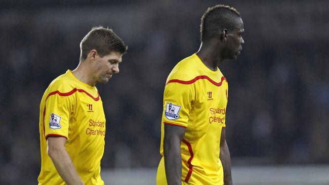 Liverpool's English midfielder Steven Gerrard (L) and Liverpool's Italian striker Mario Balotelli react at the final whistle in the English Premier League football match between West Ham United and Liverpool at The Boleyn Ground, Upton Park, in east London on September 20, 2014. West Ham won the game 3-1. AFP PHOTO/IAN KINGTON RESTRICTED TO EDITORIAL USE. No use with unauthorized audio, video, data, fixture lists, club/league logos or “live” services. Online in-match use limited to 45 images, no video emulation. No use in betting, games or single club/league/player publications.