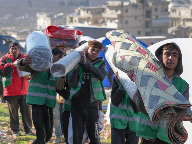 Syrians build a temporary camp, to house families made homeless by a deadly earthquake, in the town of Harim in Syria's rebel-held northwestern Idlib province. Picture: AFP