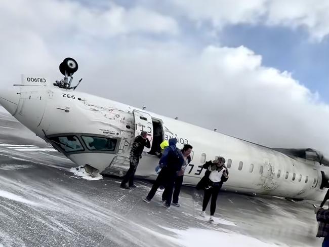 Images shot by passenger Pete Koukov who was on a Delta Air Lines plane that crashed while landing at the snowy Toronto Pearson International Airport. Picture: Pete Koukov/@eggxit Instagram