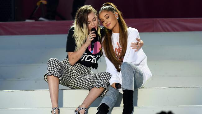 Cyrus and Grande perform on stage for the One Love memorial concert. Picture: Getty Images / Dave Hogan.