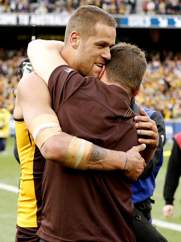 Clarkson and Franklin hug after the 2013 Grand Final. Picture by Wayne Ludbey