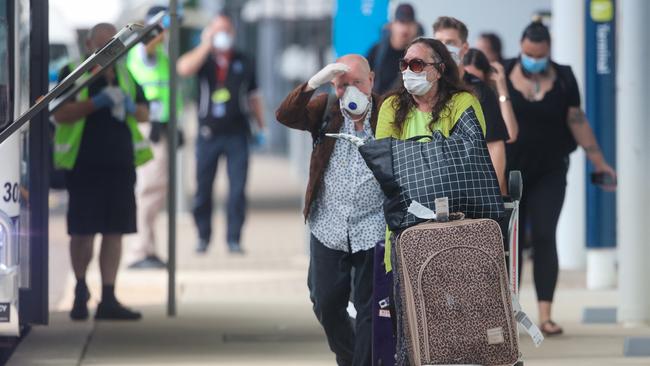 Travellers arrive at Darwin International Airport on Thursday, April 2, the first day that all interstate arrivals to the NT were required to go into 14-day mandatory quarantine. Picture Glenn Campbell