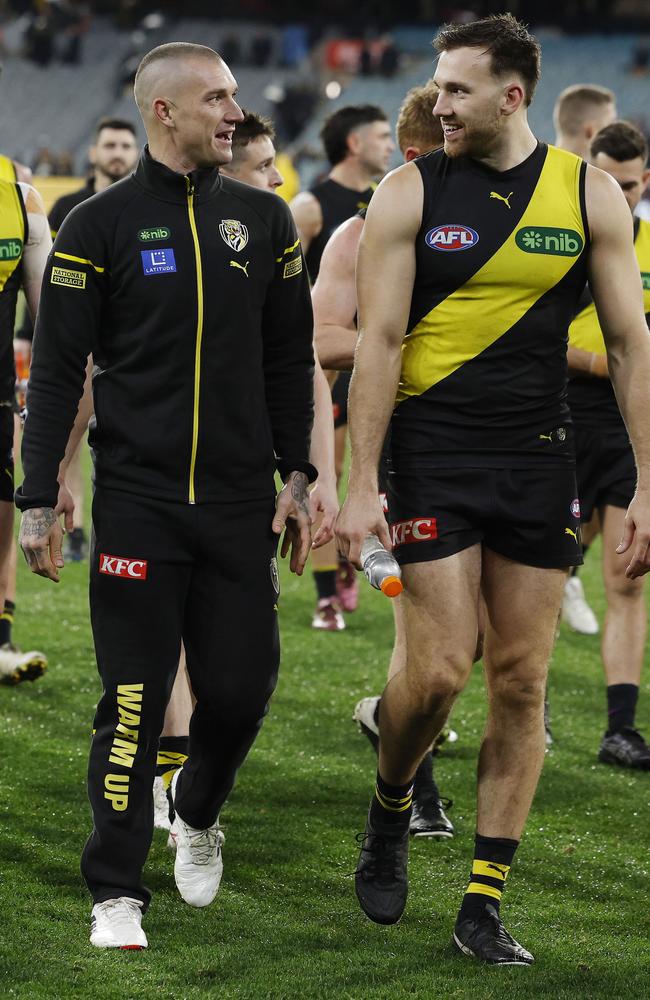 Dustin Martin walks off the MCG with Noah Balta after being subbed out against Carlton. Picture: Michael Klein