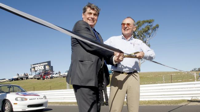 Mayor Allan Sutherland and John Tetley cutting the ribbon to officially re-open lakeside raceway for the The Queensland Drivers Championship in 2009.