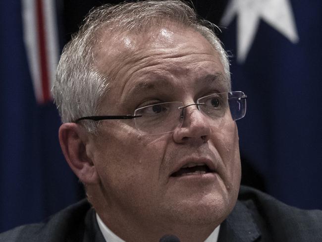 SYDNEY, AUSTRALIA - MARCH 13: Prime Minister Scott Morrison speaks during a press conference announcing that mass gatherings of 500 people or more are cancelled from Monday 16th of March. The government is also recommending against all overseas travel. The press conference followed the Council of Australian Governments (COAG) meeting on 13th of March, 2020 in Sydney, Australia. The usual agenda for the state, territory and local government leaders has been set aside to discuss measures to stop further spreading of COVID-19 in Australia. (Photo by Brook Mitchell/Getty Images)