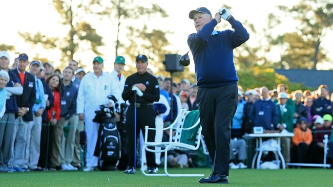 Honorary starter Jack Nicklaus plays his shot as Gary Player looks on during the first tee ceremony.