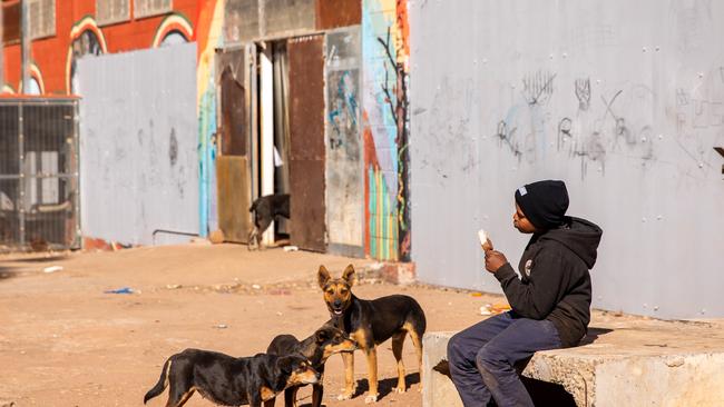 A young boy eats an ice cream outside Pukatja Store. Picture: File