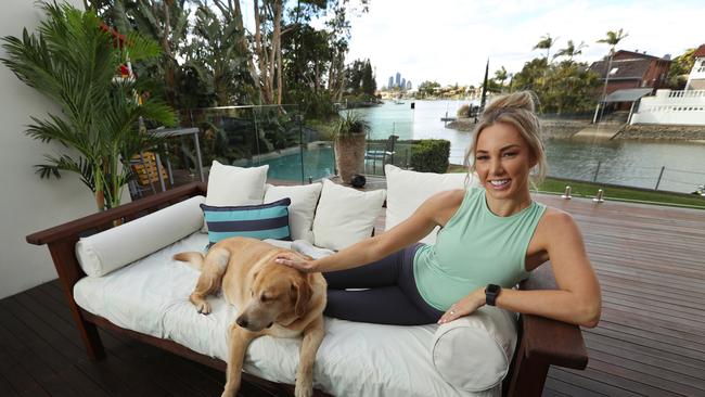 Instagram influencer and fitness entrepreneur Ashy Bines, with her dog "Scooby" at her home at Broadbeach on the Gold Coast. Lyndon Mechielsen/The Australian