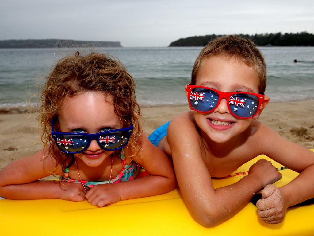 James and Gia at Balmoral Beach. This is their family’s first Australia Day after immigrating here from South Africa. Picture: John Grainger