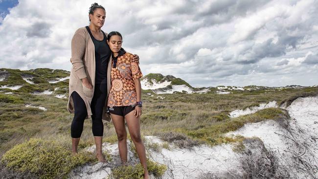 Hopevale resident Teneille Nuggins and daughter Phoenix, 15, at the dunes which are the site of the silica mine. Picture: Brian Cassey