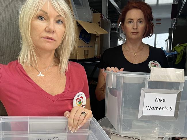 Jane Padden and Melanie Bosenberg from charity For Kids in Care with empty boxes after thieves stole items intended from children from their trailer in Oxenford. Picture: Keith Woods.