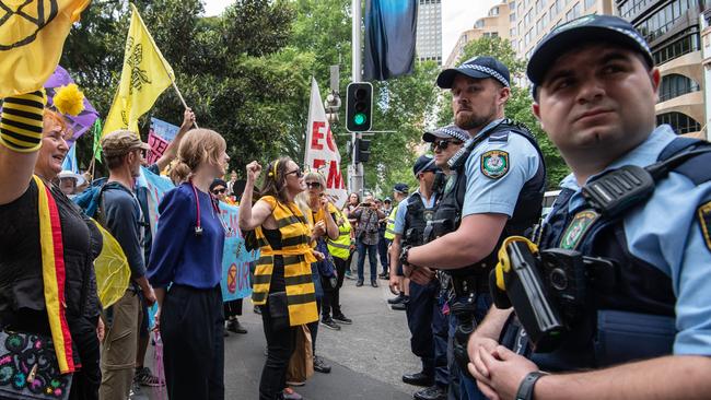 NSW Police keep a close eye on the protesters. Picture: AAP Image/James Gourley