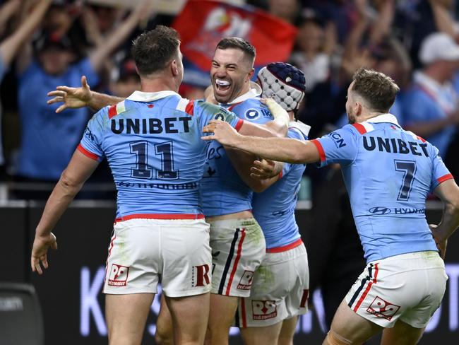 James Tedesco celebrates a try with his Roosters teammates. Picture: NRL Photos