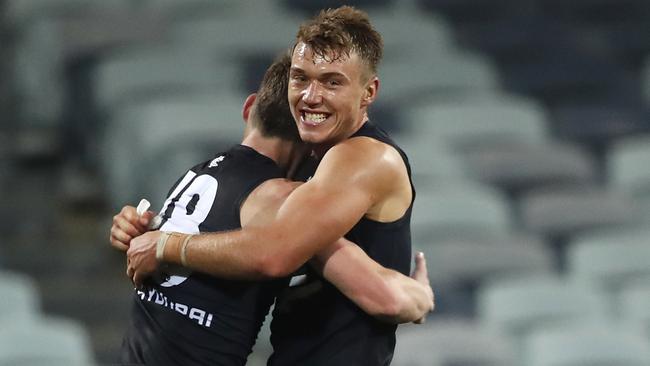 Patrick Cripps of the Blues embraces Sam Walsh of the Blues after a win during the Round 3 AFL match between the Geelong Cats and the Carlton Blues at GMHBA Stadium in Melbourne, Saturday, June 20, 2020. (AAP Image/Dylan Burns) NO ARCHIVING, EDITORIAL USE ONLY