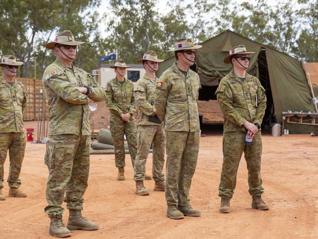 Defence members inspect Camp Birt, the temporary sleeping and recreation quarters the ADF established in Gapuwiyak for AACAP. Picture: Floss Adams.